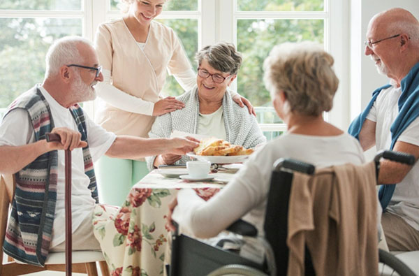 happy seniors eating breakfast in a nursing home in dallas tx